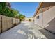 Spacious backyard featuring a concrete patio, wooden fence, and lush greenery, perfect for entertaining at 2112 Los Altos St, Las Vegas, NV 89102