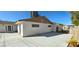 Spacious backyard area featuring a large concrete patio and mature trees at 2112 Los Altos St, Las Vegas, NV 89102