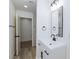 Bathroom vanity with updated tiling, flooring and black hardware at 2112 Los Altos St, Las Vegas, NV 89102
