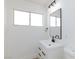 Modern bathroom features vanity sink, black hardware, and window at 2112 Los Altos St, Las Vegas, NV 89102