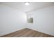 Bright bedroom with wood-look floors and a window with backyard views at 2112 Los Altos St, Las Vegas, NV 89102