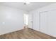 Bedroom with wood-look flooring, white walls and a closet at 2112 Los Altos St, Las Vegas, NV 89102