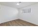 Bright bedroom with a window, wood-look flooring and white paint at 2112 Los Altos St, Las Vegas, NV 89102