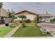 Charming single-story home with a brick and stucco exterior and tidy front yard at 2112 Los Altos St, Las Vegas, NV 89102
