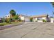 Single-story home featuring an attached garage and a well-maintained lawn and landscaping at 2112 Los Altos St, Las Vegas, NV 89102