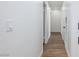 Long hallway with pristine white walls and modern wood-look flooring at 2112 Los Altos St, Las Vegas, NV 89102