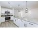 Charming kitchen with stainless appliances, granite counters and modern pendant lighting at 2112 Los Altos St, Las Vegas, NV 89102
