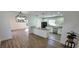 Open concept kitchen with white cabinets, granite counters, and stainless steel appliances at 2112 Los Altos St, Las Vegas, NV 89102