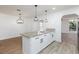 Bright kitchen showcasing granite countertops, modern lighting, and an open layout at 2112 Los Altos St, Las Vegas, NV 89102