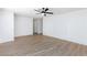 Spacious living room with continuous wood-look flooring and a ceiling fan at 2112 Los Altos St, Las Vegas, NV 89102