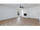 Living room boasting a stone fireplace, ceiling fan, and wood-look flooring at 2112 Los Altos St, Las Vegas, NV 89102