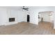 Open living area featuring a fireplace, ceiling fan, and wood-look flooring at 2112 Los Altos St, Las Vegas, NV 89102