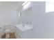 Clean, bright bathroom with a modern white vanity, toilet, and large mirror at 2313 Van Patten Pl, Las Vegas, NV 89104