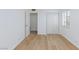 Bright bedroom featuring light wood floors, closet, and window at 2313 Van Patten Pl, Las Vegas, NV 89104