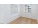 Cozy bedroom featuring wood-look flooring, fresh white walls, and natural light at 2313 Van Patten Pl, Las Vegas, NV 89104