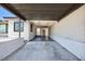 Spacious carport providing ample covered parking with a view of the front entrance and clean white interior at 2313 Van Patten Pl, Las Vegas, NV 89104