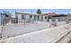 Charming single-story home featuring a block wall and decorative iron fencing for added curb appeal and security at 2313 Van Patten Pl, Las Vegas, NV 89104