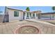 Charming single-story home featuring updated landscaping with a circular planter and driveway approach at 2313 Van Patten Pl, Las Vegas, NV 89104