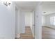 Bright hallway featuring wood-look flooring and neutral paint, providing a clean and modern aesthetic at 2313 Van Patten Pl, Las Vegas, NV 89104