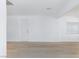 Bright living room featuring wood-look flooring, fresh white walls, and a front door at 2313 Van Patten Pl, Las Vegas, NV 89104
