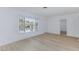 Bright, open living room featuring new flooring, fresh white walls, and natural light at 2313 Van Patten Pl, Las Vegas, NV 89104