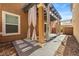 Back patio showcasing a charming pergola adorned with flowing curtains for a relaxing outdoor space at 2385 Via Firenze, Henderson, NV 89044