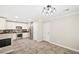 Modern kitchen with stainless steel appliances, white cabinets, and lots of space at 2385 Via Firenze, Henderson, NV 89044