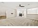 Open-concept living room with modern lighting and staircase access at 2385 Via Firenze, Henderson, NV 89044