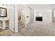 Bright living room featuring neutral paint, carpet, and staircase at 2385 Via Firenze, Henderson, NV 89044