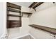 Custom walk-in closet with shelving, drawers, and hanging rods for optimal storage at 2385 Via Firenze, Henderson, NV 89044