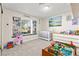 Cozy Bedroom with built-in shelves, a crib, and a dresser, creating a sweet and playful atmosphere at 2426 La Pluma St, Henderson, NV 89014