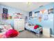 Bright bedroom featuring two twin beds, dresser, and blue-themed decor for a space at 2426 La Pluma St, Henderson, NV 89014
