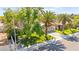 Well-maintained home with mature trees, a green lawn, and a two-car garage at 2426 La Pluma St, Henderson, NV 89014