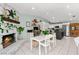 Spacious kitchen with island and stone fireplace next to a dedicated desk area at 2426 La Pluma St, Henderson, NV 89014