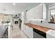Bright kitchen features white cabinets, butcher block countertops, and a cozy dining space with a fireplace at 2426 La Pluma St, Henderson, NV 89014