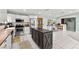 Open kitchen featuring stainless steel appliances, a center island, and easy access to the adjacent living areas at 2426 La Pluma St, Henderson, NV 89014