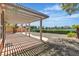 Enjoy outdoor living on this covered patio with views of the lake and lush landscaping at 2537 Seascape Dr, Las Vegas, NV 89128