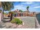 Spacious backyard with desert landscaping and a covered patio at 2537 Seascape Dr, Las Vegas, NV 89128
