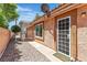 Charming backyard with covered patio and desert landscaping at 2537 Seascape Dr, Las Vegas, NV 89128