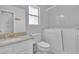 Bathroom featuring a walk-in bathtub with easy access, granite counters, and single sink at 2537 Seascape Dr, Las Vegas, NV 89128