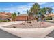 Charming single-story home featuring desert landscaping, circular driveway, and a two-car garage at 2537 Seascape Dr, Las Vegas, NV 89128