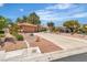 Inviting single-story home boasting well-maintained landscaping, a circular driveway, and a two-car garage at 2537 Seascape Dr, Las Vegas, NV 89128