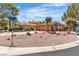 Charming single-story home featuring desert landscaping, circular driveway, and a two-car garage at 2537 Seascape Dr, Las Vegas, NV 89128