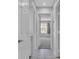 Bright hallway leading to a bedroom with natural light streaming through the window at 2537 Seascape Dr, Las Vegas, NV 89128