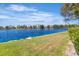 Picturesque view of the community lake with grassy shoreline at 2537 Seascape Dr, Las Vegas, NV 89128