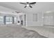 Bright living room with carpet, tile, a fireplace, lots of light, and a double-door entry at 2537 Seascape Dr, Las Vegas, NV 89128
