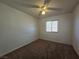 Bedroom featuring carpet floors, white walls, ceiling fan and window at 256 Winona Ter, Henderson, NV 89015