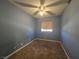 Bedroom features carpet floors, blue walls, ceiling fan and window at 256 Winona Ter, Henderson, NV 89015