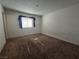 A basic bedroom with carpet, white walls and a window with blinds at 256 Winona Ter, Henderson, NV 89015
