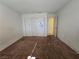 Empty bedroom with carpet flooring, closet and access to another room at 256 Winona Ter, Henderson, NV 89015